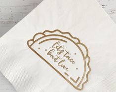 a white napkin with gold foil on it