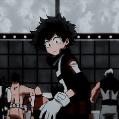 an anime character with black hair and white gloves standing in front of other characters,