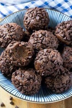 chocolate muffins on a blue and white plate