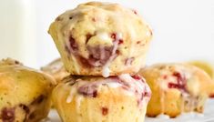 three strawberry muffins stacked on top of each other