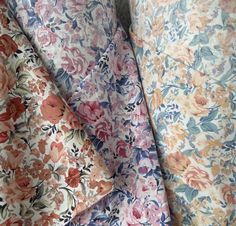 two different colored floral fabrics on top of each other, one is pink and the other is blue