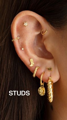 a woman wearing gold ear piercings on her left ear with the words studs written below it