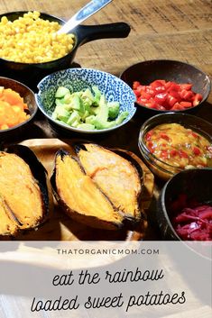 a table topped with bowls filled with different types of vegetables and sauces on top of it