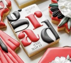 some decorated cookies are sitting on a table