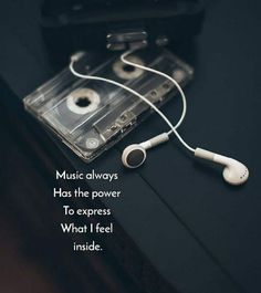 an old cassette player with headphones on top of it and the words music always has the power to express what i feel inside