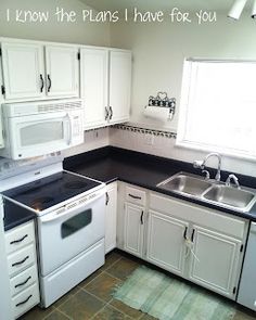 a kitchen with white cabinets and black counter tops is pictured in this image, the words i know the plans i have for you