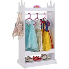 a white coat rack with clothes and shoes on it