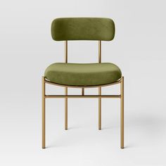 a green upholstered chair with a wooden frame and back support, viewed from the front