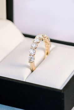 a diamond ring in a box on a table