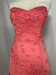 Coral strapless dress with a sweetheart neckline, this mermaid style gown is covered in beadwork and flower detail throughout.  Truly a wonder to behold! This is a high quality private label designer apparel and items are tagged with UK sizing but listing reflects US sizing to simplify size selection.   Please check out our additional inventory and learn more about the company at at jerryhollandfoundation.org .  You can also use the coupon code 35OFF on our website to get 35% off of the list price of your entire order! Prom Season Gown With Floral Applique And Sweetheart Neckline, Sweetheart Neckline Gown With Floral Applique For Prom, Floral Applique Gown With Sweetheart Neckline For Prom, Formal Pink Mermaid Dress With Sweetheart Neckline, Homecoming Embellished Mermaid Dress With Fitted Bodice, Prom Gown With Floral Applique And Sweetheart Neckline, Pink Mermaid Dress With Sweetheart Neckline For Prom, Evening Dress With Sweetheart Neckline And Floral Applique, Evening Dress With Floral Applique And Sweetheart Neckline