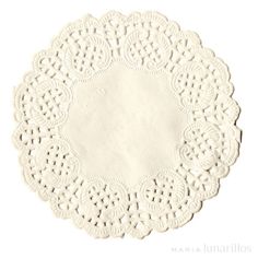 a white doily is shown on a white tablecloth with an oval design in the center