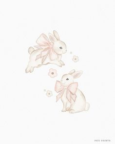 two white rabbits with pink bows on their ears, one sitting down and the other standing up