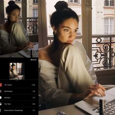 a woman sitting at a table with a laptop computer in front of her and an image of herself on the screen