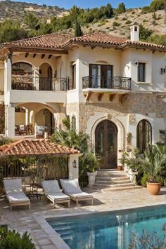 a large house with a pool in front of it