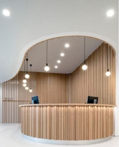 the interior of a modern office building with wood paneling