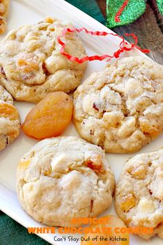 a white plate topped with cookies and carrots