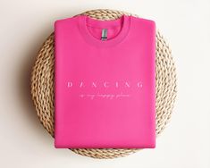 Crewneck Sweatshirt: "Dancing is My Happy Place" Wrap yourself in comfort while embracing your passion with our cozy crewneck sweatshirt! Featuring the heartwarming slogan "Dancing is My Happy Place," this sweatshirt is perfect for dancers who live for the joy and freedom of movement. Crafted from ultra-soft fleece fabric, it offers warmth and style, making it ideal for layering during warm-ups, cool-downs, or casual outings. The relaxed fit ensures all-day comfort, while the durable print stays Crew Neck Cotton T-shirt For Dance, Pink Crew Neck T-shirt For Dance, Crew Neck Graphic Print Sweatshirt For Dance, Text Print Crew Neck T-shirt For Dance Class, Dance Class Graphic Print Crew Neck T-shirt, Dancer Gift, Team Apparel, Dance Teams, Kids Sweatshirt