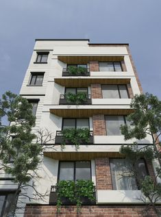 an apartment building with plants growing on the balconies