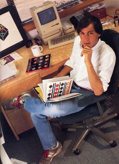 a man sitting in an office chair looking at the camera