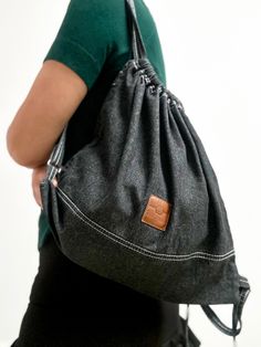 ❇️A lightweight mini black backpack purse could be the best every day carry bag. This cute  frayed denim drawstring bag has an inside pocket to keep your small personal items. On the back side of this stylish bag strap, there is a short handle, making it convenient to carry in the hands when necessary. Drawstrings of the small backpack are adjustable.  ❇️This canvas backpack is comfortable and  soft to touch to the body. Although minimalist, this stylish backpack accommodates the most necessary things. It is a great companion for everyday walks or holidays when you want to carry as little weight as possible. It is also suitable for carrying minimal sports, yoga, or other gear when heading to exercise.  ❇️Packaged in a box.  It can be a fashion practical travel gift ❇️Material: Made from st Black Denim Travel Bag, Casual Backpack For Back To School, Casual Black Backpack For Back To School, Black Large Capacity Drawstring Backpack, Black Casual Backpack For Daily Use, Casual Black Backpack For Daily Use, Casual Adjustable Backpack For Back To School, Denim Bags For Everyday Use And Back To School, Trendy Drawstring Bags For Everyday Use