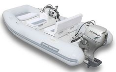 an inflatable boat with two motor boats on the front and one is white