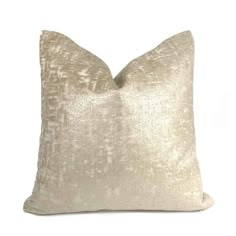 a gold velvet pillow on a white background