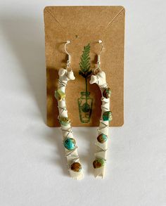 These Earrings are handmade and ethically sourced. They are crafted with wire and brought together with different stones and crystals onto a perfectly natural bone. These Earrings will make any outfit stand out! They are about 3.80, 4 or 4.75 inches long and dangle away from your shoulder with beautiful stones. Even though they might look heavy they are not with weighing only 8 or 15 grams depending on the size! The bones are from a fawn who passed away on our property, they were then collected Bone Crafts Earrings, Deer Bone Jewelry, Animal Bone Jewelry Clay, Diy Bone Jewelry, Bone Earrings Handmade, Unique Bone-colored Nickel-free Earrings, Bohemian Bone-colored Nickel-free Earrings, Bone Color Dangle Earrings With Ear Wire, Bohemian Bone-colored Pierced Earrings