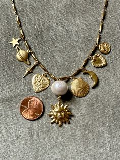 "Sun" necklace features a curated selection of vintage brass charms from the 60s, 70s and 80s from France, Italy, and the United States. Charms are finished with a layer of Renaissance wax, the same finish used by art conservators in British Museum. "Sun" necklace measures 16" - 18" long on an adjustable chain. Sun Charm Necklace, Dream Items, 70s Jewelry, Galaxy Earrings, Sun Charm, Sun Necklace, France Italy, Golden Sun, Brass Charms