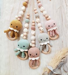 several crocheted toys are arranged on a bed