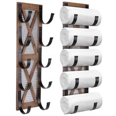 a wooden rack with four rolls of toilet paper hanging from it's sides, and three roll holders on each side