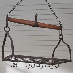 a metal rack with hooks hanging from it