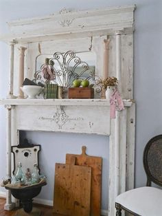 an old white fireplace in a living room