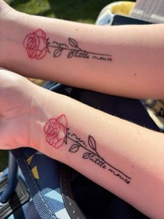 two people with matching tattoos on their arms, one has a rose and the other has a name