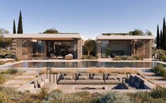 an outdoor living area next to a swimming pool