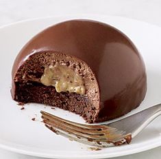 a piece of chocolate cake on a plate with a fork