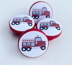 four red and white firetruck cupcake toppers