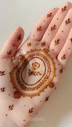 a woman's hand with hendi designs on it