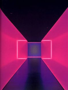 an empty room with pink and purple lights on the walls, in front of a black background