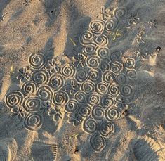 the sand has spiral designs on it