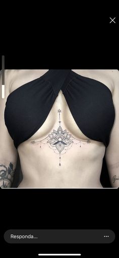 an image of a woman with tattoos on her stomach and chest, showing the side view of