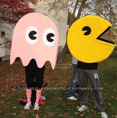 two people dressed up as pacman and ghost