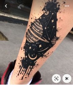 a black and white tattoo on the leg of a person