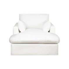 a white chair with pillows on it