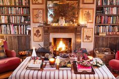 a living room filled with furniture and a fire place in the middle of a room