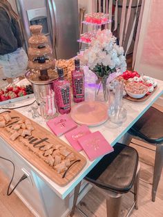 a table topped with lots of food and desserts