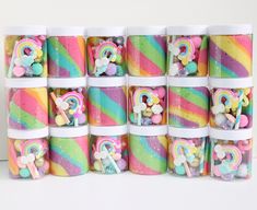 several cups filled with candy and marshmallows