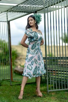 Get ready for sunny days in this charming Floral Midi Dress! It features a delightful White and Green Leaf print, perfect for summer or spring outings. With spaghetti straps and a sleeveless design, it's both stylish and comfy. Made from Georgette Satin, it's ideal for casual wear or holiday resort vibes. Slip into this lovely dress for a relaxed yet chic look, whether you're strolling on the beach or enjoying a brunch with friends. A must-have addition to any woman's wardrobe Item - Midi Dress Green Sleeveless Midi Dress For Summer, Tropical Sleeveless Sundress For Day Out, Summer Sundress With Spaghetti Straps For Garden Party, Tropical Halter Neck Dresses For Summer Parties, Summer Garden Party Sundress With Spaghetti Straps, Sleeveless Floral Print Sundress For Picnic, Summer Sleeveless A-line Dress For Garden Party, Summer Floral Sundress With Spaghetti Straps, Spring Sleeveless Sundress For Picnic