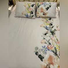 a bed with two pillows on top of it