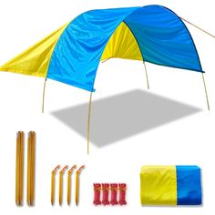 a blue and yellow tent with some straws next to it on a white background