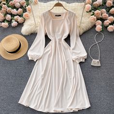 Cream A-line Winter Dress, Beige A-line Long Sleeve Dress For Spring, Spring Long Sleeve Dress In Solid Color, Long Sleeve Solid Color Spring Dress, Chic Long Sleeve Square Neck Dress For Spring, Solid Color Long Sleeve Spring Dresses, Spring Solid Color Long Sleeve Dress, Beige Long Sleeve Dress For Brunch, Long Sleeve Cream Summer Dress